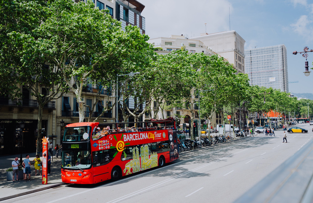 BARCELONA, SPAIN - April 26, 2018: Barcelona city tour touristic bus with tourists on the route around Barcelona, Spain