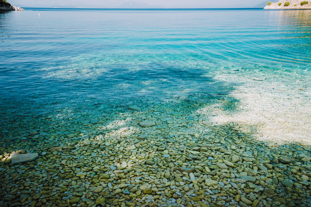 Stones Seen Through The Crystal Clear Waters Of Mediterranean Sea