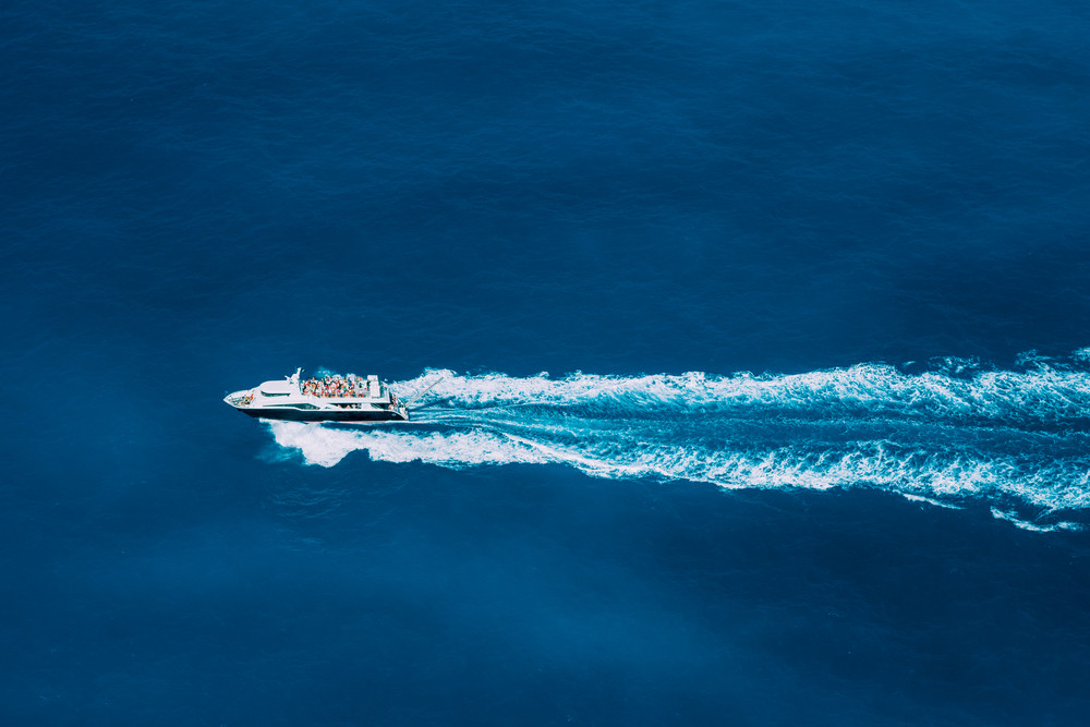 Tourist boat in full speed in open sea, Greece