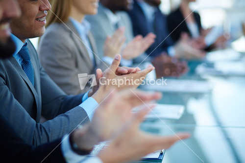 Young Business Partners Applauding To Reporter After Listening To Presentation At Seminar