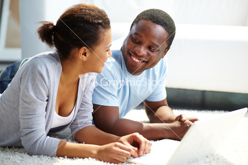 Image Of Young African Couple Spending Free Time At Home