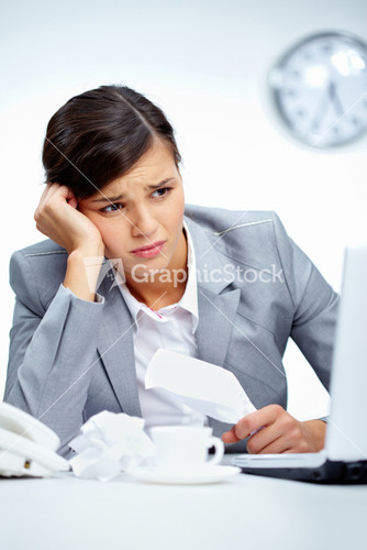 Vertical Shot Of An Office Lady Being Depressed With The Current Business Situation