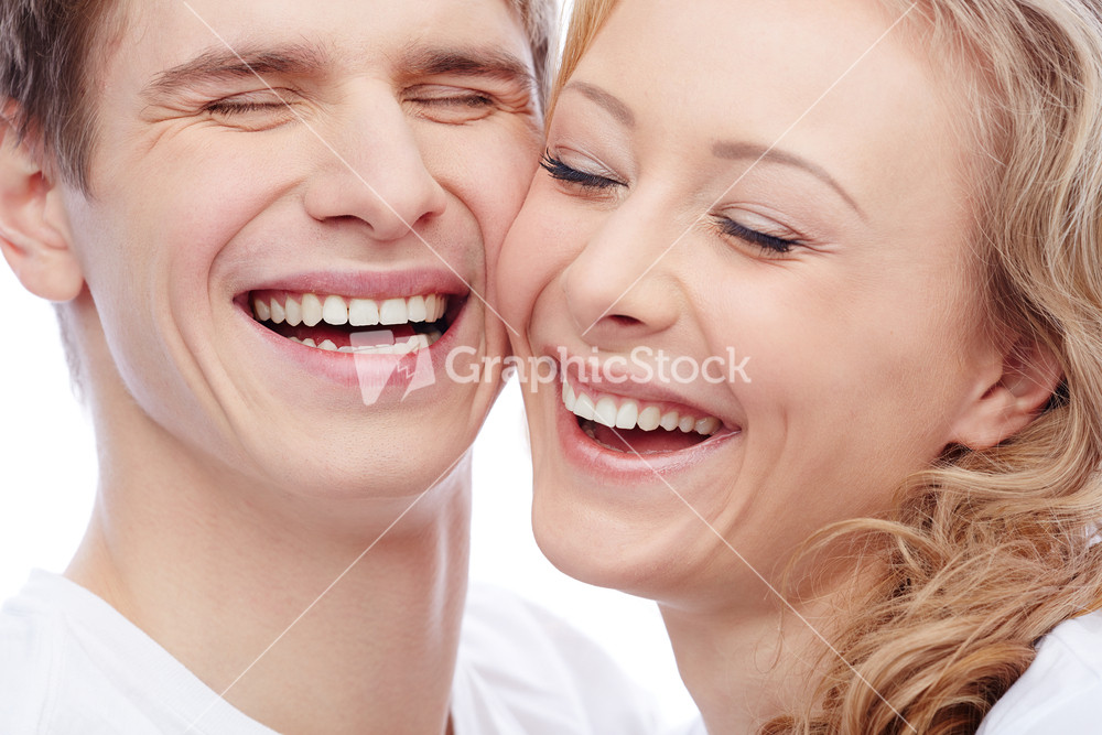 Faces Of Amorous Young Couple Laughing With Closed Eyes