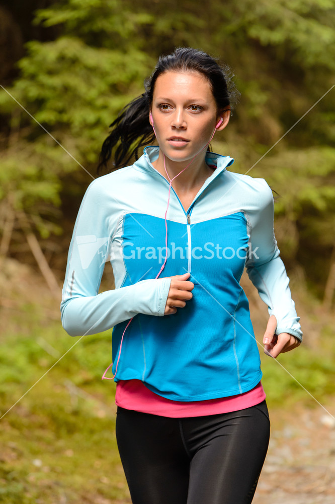 Running woman with headphones outdoor close-up