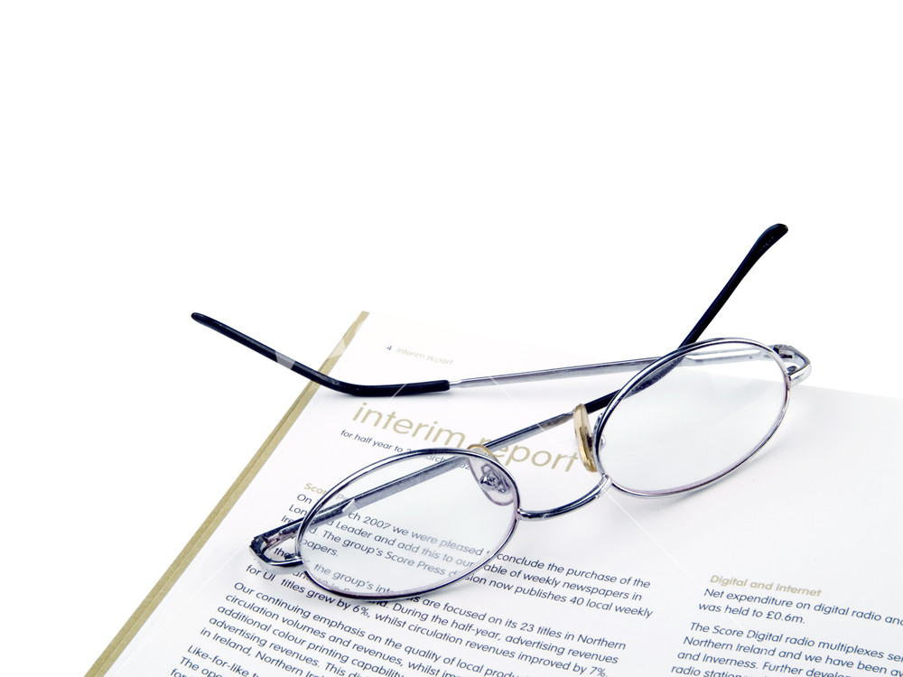 Desktop Composition With Annual Report & Glasses Isolated On White