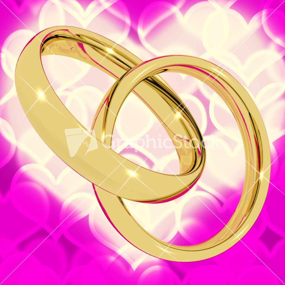 Gold Rings On Pink Heart Bokeh Background Representing Love Valentine And Romance
