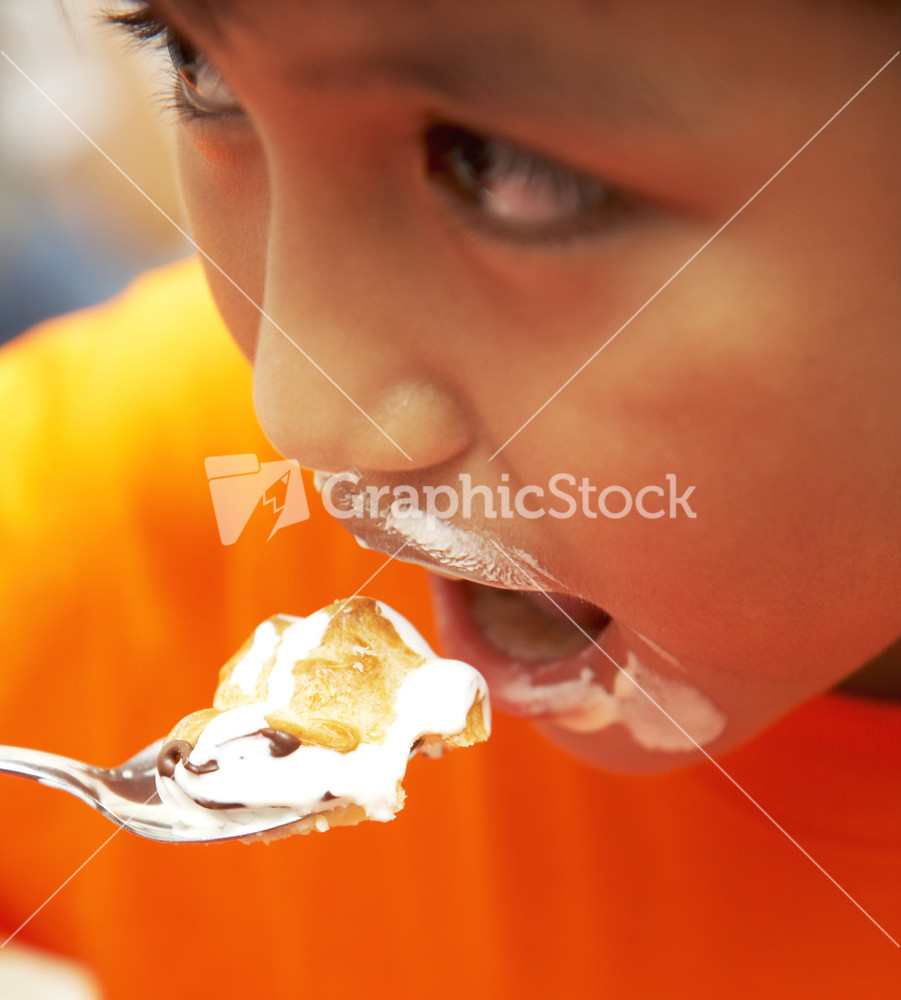 Messy Kid Eating Cream Cake Dessert