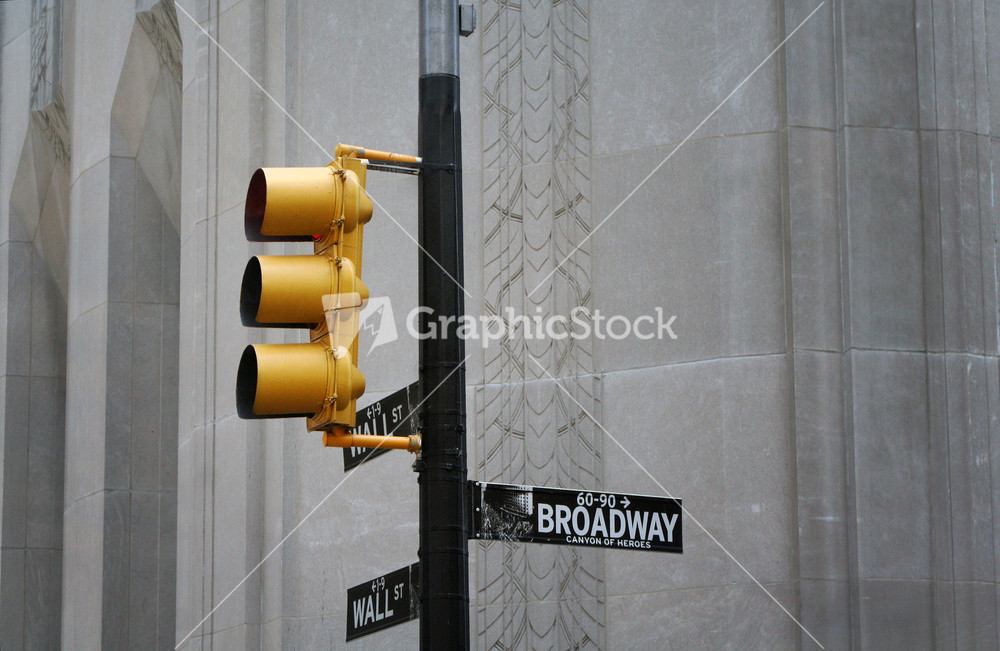 Yellow Traffic Light With Broadway Street Sign